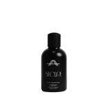 A matte black bottle of SECLAE Sun Melaniniser with a matching black cap, standing upright on a light gray background.
