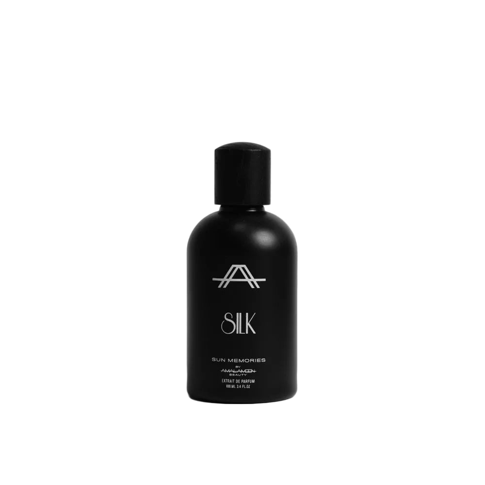 A matte black bottle of Silk Sun Kemonis sunscreen with a matching black cap, centered against a light gray studio background.