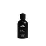A matte black bottle of AHA SPICE Sun Memories SPF 30 sunscreen with a matching black cap, set against a clean light gray background.
