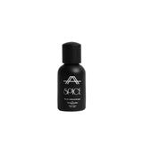 Studio product photograph of the Amal Ameen Beauty spice  Hair Mist 30ml bottle, featuring a sleek black cylindrical canister with silver branding text over a clean grey background.