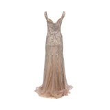 Rear view of the Andrea & Leo Couture gown showing the V-back design, intricate beadwork patterns, and the soft tulle train.
