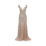 Front view of an Andrea & Leo Couture evening gown in champagne featuring silver sequin baroque patterns and a flared mermaid hem.