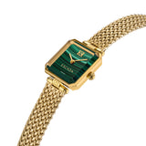 An angled perspective shot of the square gold luxury women's watch, showcasing the beveled golden bezel geometry, the crown, and the natural graining of the green dial.