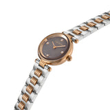 An angled close-up profile photograph of the Escada Scarlett watch emphasizing the polished rose gold case edge, the curved crown, the glass bezel, and the clean multi-link design of the mixed-metal band.