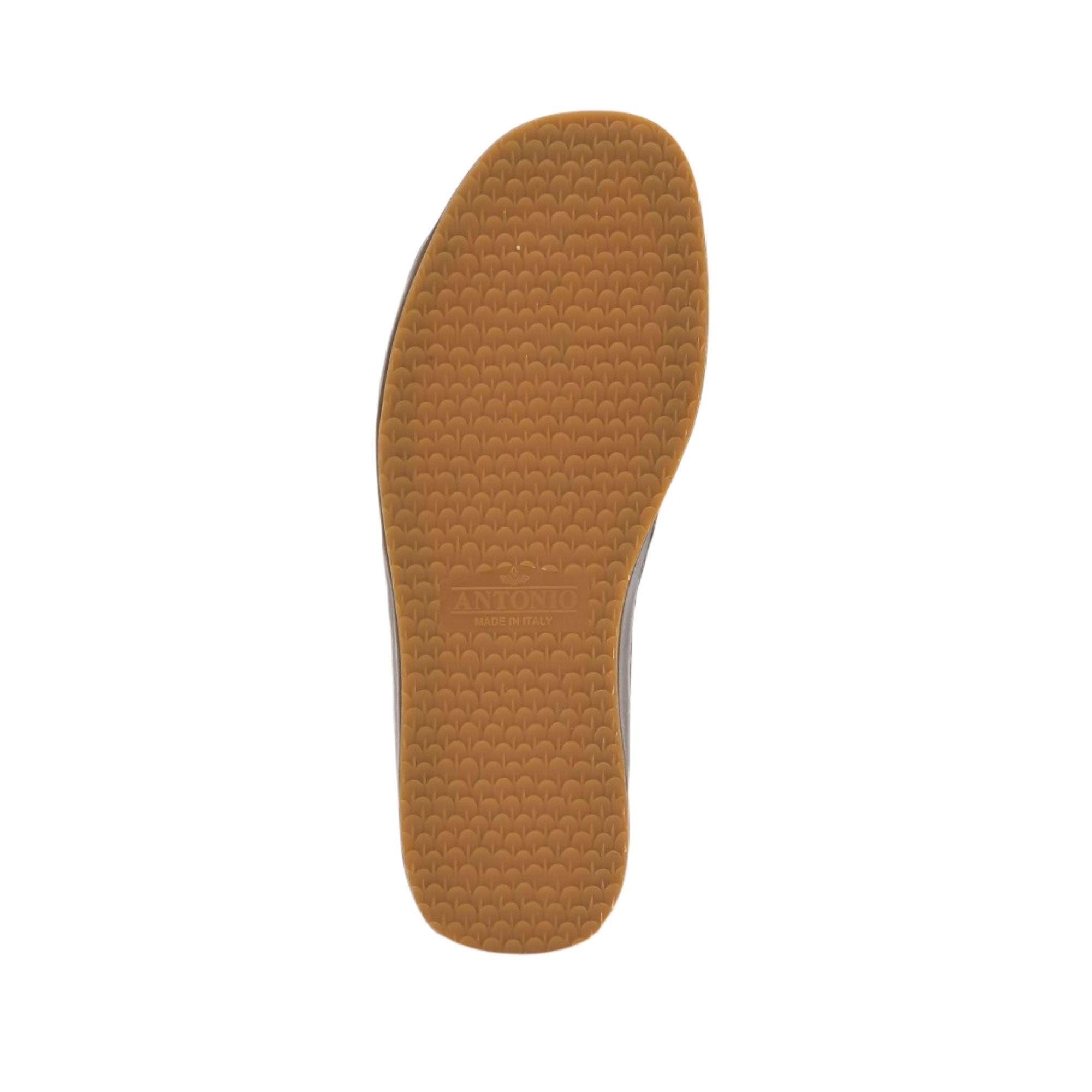 Full bottom view of the Antonio sandal outsole, featuring a honey-colored rubber traction tread patterned with tight geometric lines and centered brand detailing against a white background.