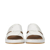 Front view of a pair of Antonio white Arabic sandals, highlighting the dual overlapping straps with contrasting textures and fine accent stitching against a white background.