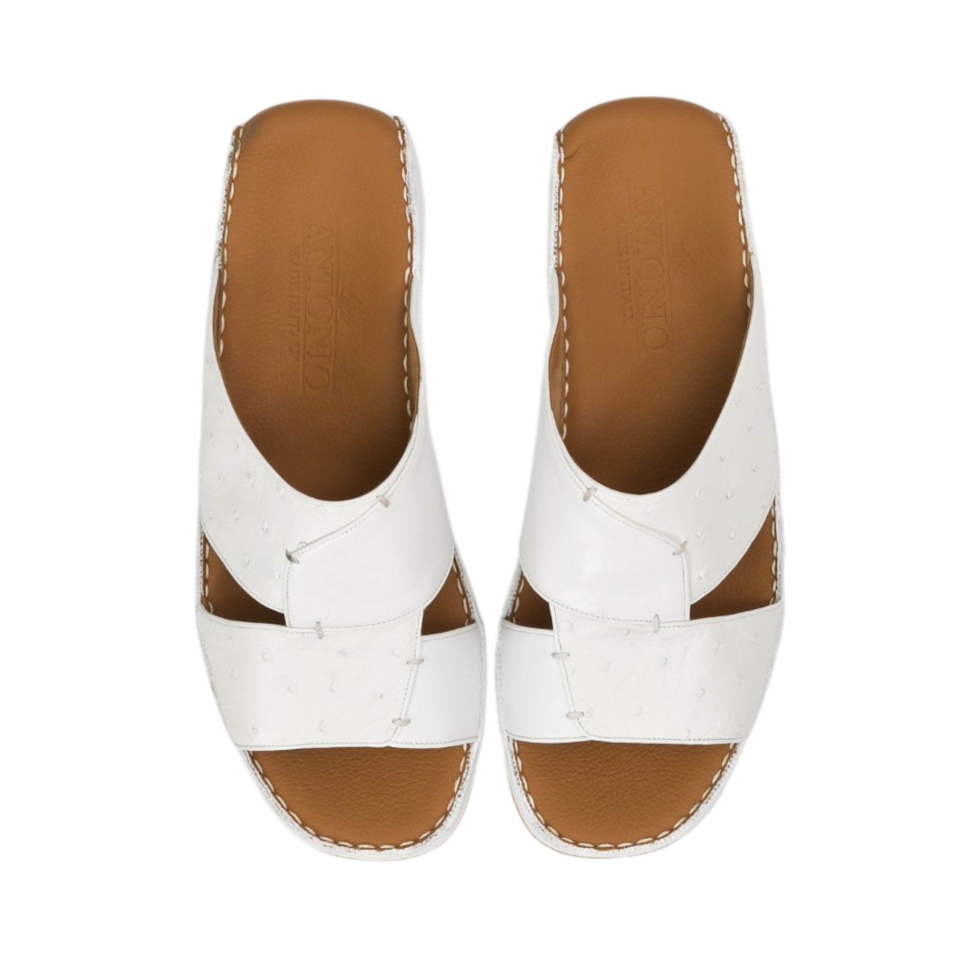 Direct top-down view of a pair of Antonio sandals showing the smooth tan leather insoles debossed with the Antonio logo and 'Made in Italy' emblem against a white background.