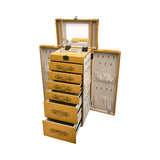 Angled view of the Artisan standing vanity trunk showing the depth of the drawers and the velvet-lined interior compartments.