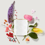 White cylindrical CREED Aventus candle with embossed crests and a gold-toned rim