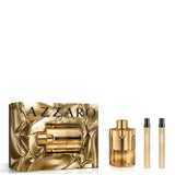 Azzaro perfume set with gold and bronze bottles on a white background