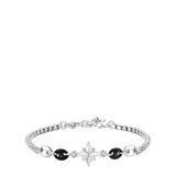 Silver-toned steel bracelet with a central silver-toned wind rose charm and two black oval beads on either side.