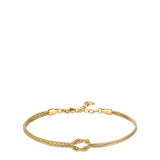 Gold-toned bracelet with a central knot. One side features two textured chains, the other two smooth snake chains. Lobster cl