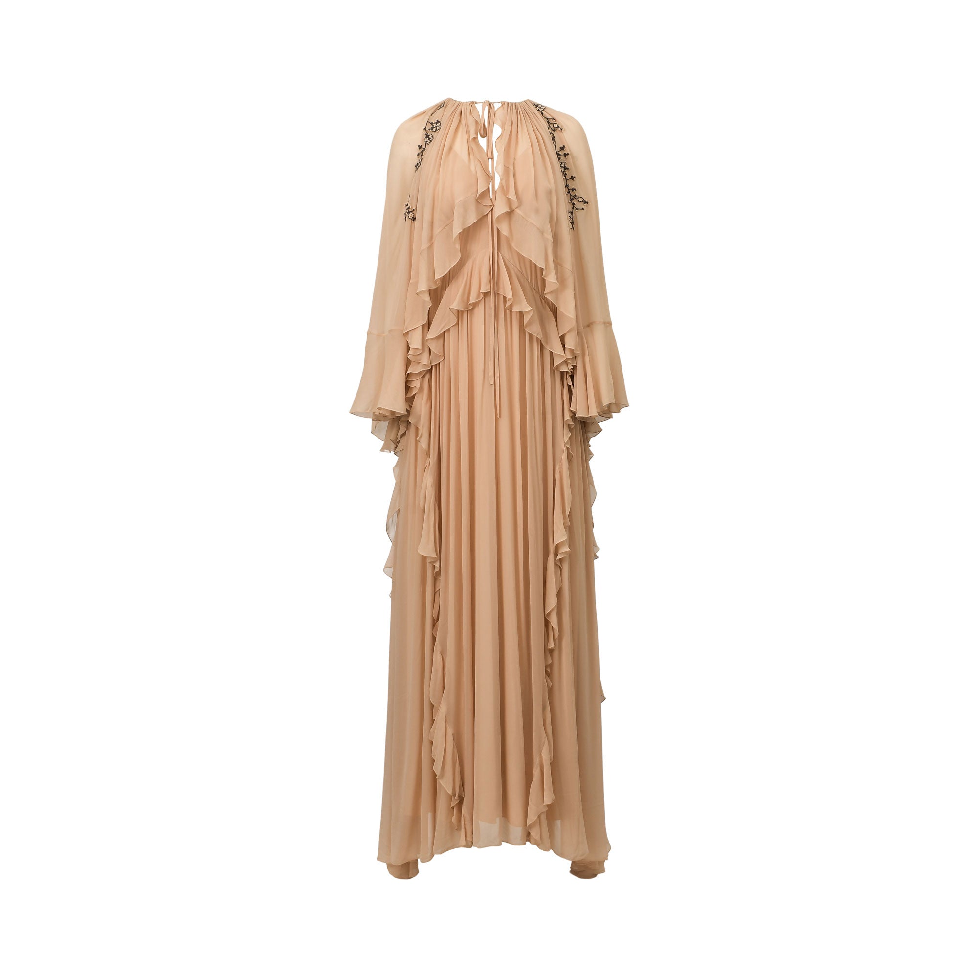 Powder-coloured flowing maxi dress with tiered ruffles, wide sleeves, V-neck tie, and black embroidery on shoulders.