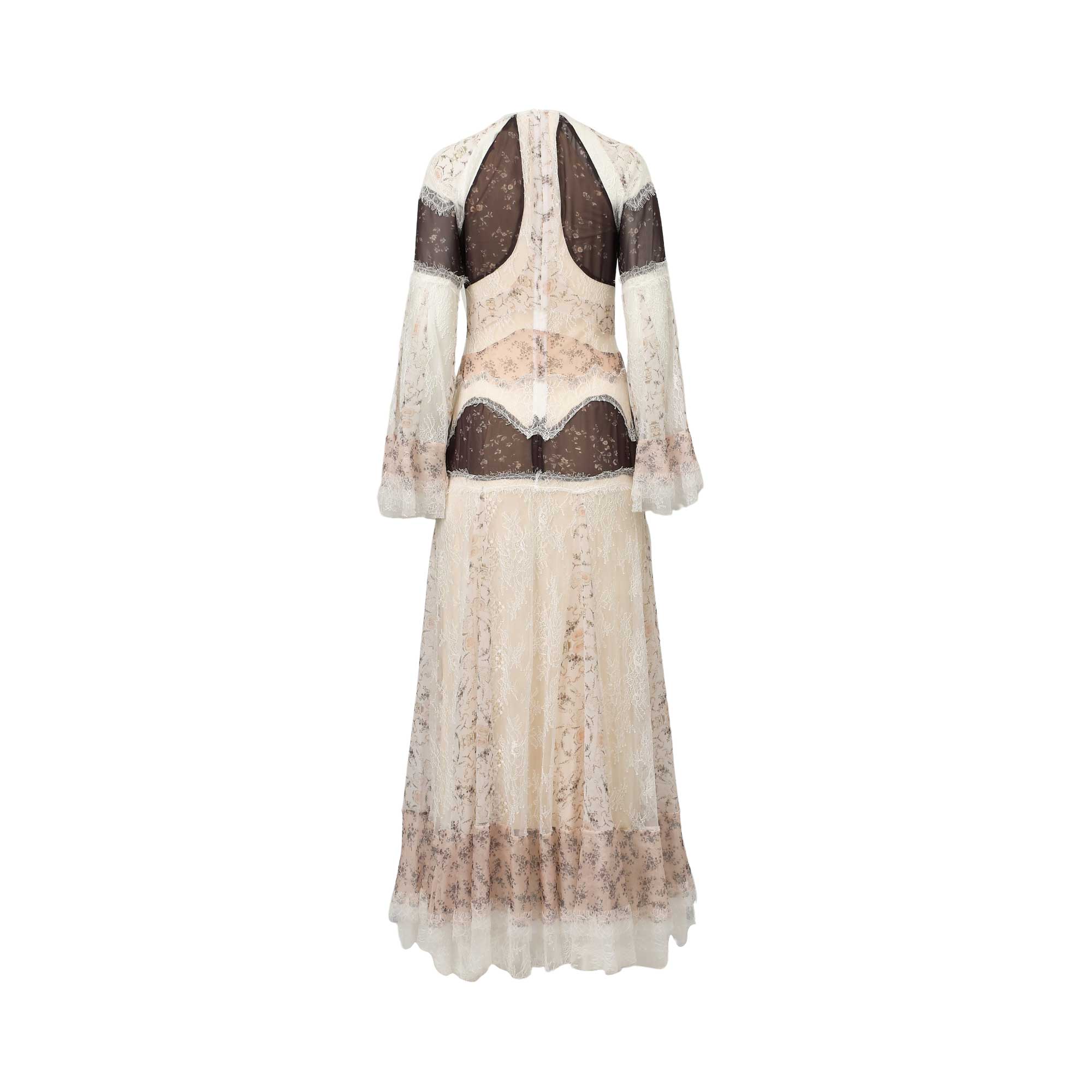 Cream lace maxi dress with sheer dark brown panels, floral patterns, long bell sleeves, and a V-cut back.
