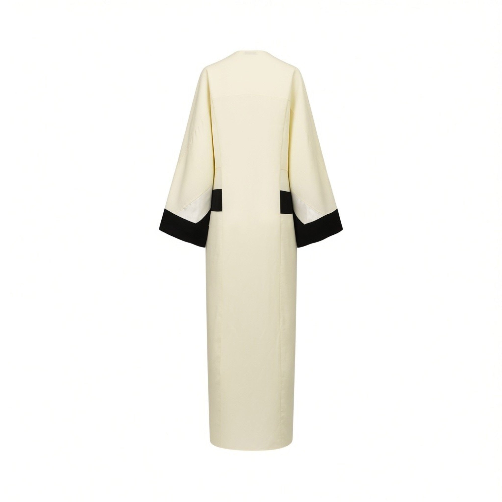 Bone abaya with wide, 3/4 sleeves. Black angular trim on cuffs and black vertical side panels. Subtle ribbed texture.
