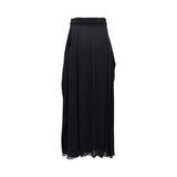 BAQA designer black maxi skirt with a high-waisted structured belt, silver buckle, and flowing pleated fabric.