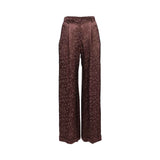 Front view of BAQA wide-leg trousers in a deep rust floral jacquard fabric, featuring a high-waisted pleated design and a relaxed silhouette against a white background.