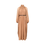 BAQA sandstone beige maxi dress with fine plissé pleating, a high neck, and a slim black belt on a white background.