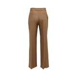 BAQA toffee brown tailored trousers featuring a unique asymmetric fold-over waistband with silver metallic bar accents.