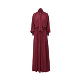 Front view of a BAQA burgundy maxi dress featuring a tie-neck scarf detail, long sleeves with smocked cuffs, and a wide smocked waistband on a white background.