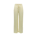 BAQA pale yellow satin wide-leg trousers with a subtle polka-dot pattern and an elasticated drawstring waist.