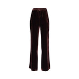 Back view of BAQA velvet trousers highlighting the comfortable elasticated waistband and rich fabric texture.