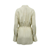 BAQA cream-colored oversized shirt with fine vertical pinstripes, featuring a rope waist tie and wide cuffs against a white background.