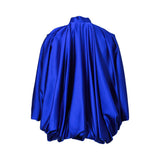 BAQA royal blue satin cape-style top featuring voluminous draped sleeves and a flowing tie-neck design.