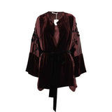 Front view of BAQA plum velvet kimono with satin sleeves, embroidery, and a black velvet belt.