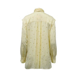 BAQA yellow long-sleeved blouse featuring a geometric polka-dot pattern and a large pussy-bow necktie on a white background.