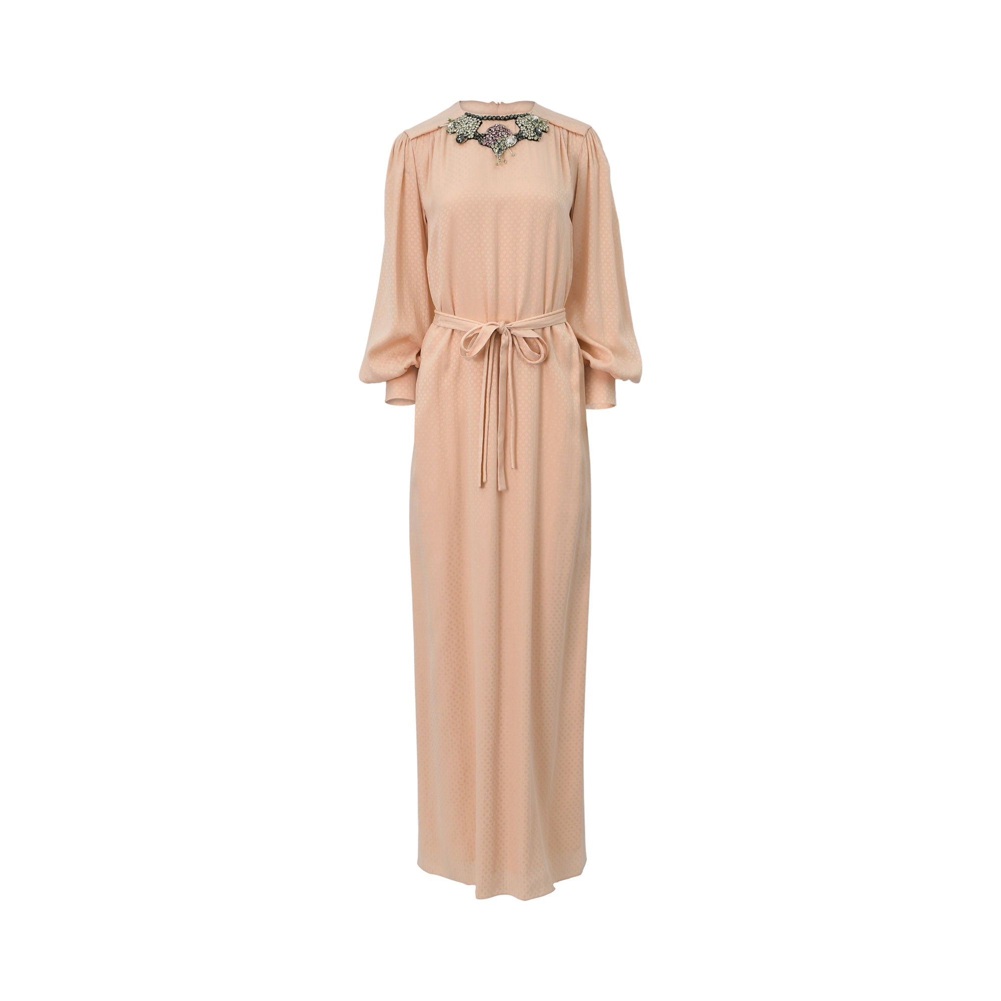 Front view of a long peach-colored BAQA maxi dress featuring a crystal and beaded statement neckline, voluminous bishop sleeves, and a matching self-tie belt.