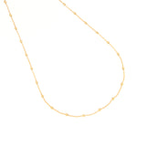 Gold-toned delicate chain necklace with evenly spaced, small, textured spherical beads.