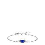 Silver-toned chain bracelet with a rectangular deep blue stone centered between two clusters of small white zircons. Extender