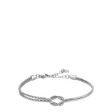 Silver-toned women's steel bracelet with a central knot design, featuring one textured and one smooth strand, and an adjustab