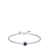Silver-toned steel tennis bracelet with a continuous line of white zirconia stones and a central blue round zirconia stone su