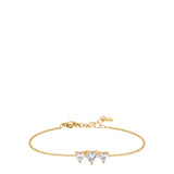Gold-toned steel chain bracelet with three white heart-shaped zircons, a lobster clasp, and an extender chain.