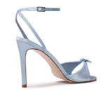Rear three-quarter view of the BLACK SUEDE STUDIO Albie 100 blue satin high heel sandal showing the heel and sole curve.