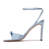 BLACK SUEDE STUDIO Albie 100 light blue satin stiletto sandal shown from the inner side profile view.