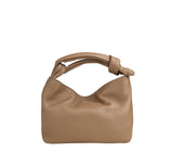 Piumelli Bonbon Mud top-handle bag in grained leather with knotted handle and gold logo.