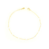 Gold-toned delicate chain bracelet with clear faceted zircon embellishments, a lobster clasp, and an extender chain.