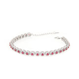 Silver-toned link bracelet featuring square settings with central ruby-red stones surrounded by clear pavé stones.