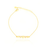 Gold-toned delicate chain bracelet with five heart charms, two of which are encrusted with clear stones, and a lobster clasp.