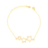 Gold-toned delicate chain bracelet with three star charms, two encrusted with clear stones and one plain outline.