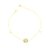 Gold-toned chain bracelet with a central clear-stone encrusted rose charm, two small clear stone charms, and a lobster clasp.