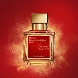Clear rectangular glass perfume bottle with a gold-toned cap and a red label displaying 'Baccarat Rouge 540 Eau de parfum'.