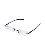 B+D rimless reading glasses with clear +1.00 HD lenses, slim dark temples, and minimalist gunmetal bridge