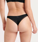Back view of model wearing the Sloggi Body Adapt Twist black Brazil panty, showing the mesh waistband and high-cut leg. Shop Online Today