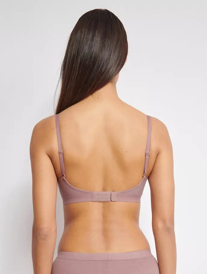 Back view of model wearing the Sloggi Ever Ease light purple padded bra, showing the adjustable straps and back closure. Now Available Online