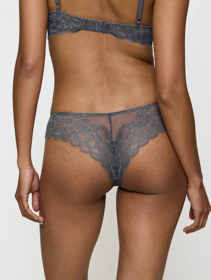 Back view of model wearing the Triumph Sensual Spotlight grey highleg Brazilian panty, showcasing the sheer mesh and high-cut lace detailing. Shop Online Today