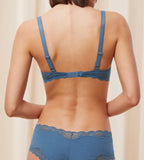 Back view of second Model wearing the Triumph Natural Spotlight blue wired bra, showcasing the adjustable straps and back closure. Available Online Now